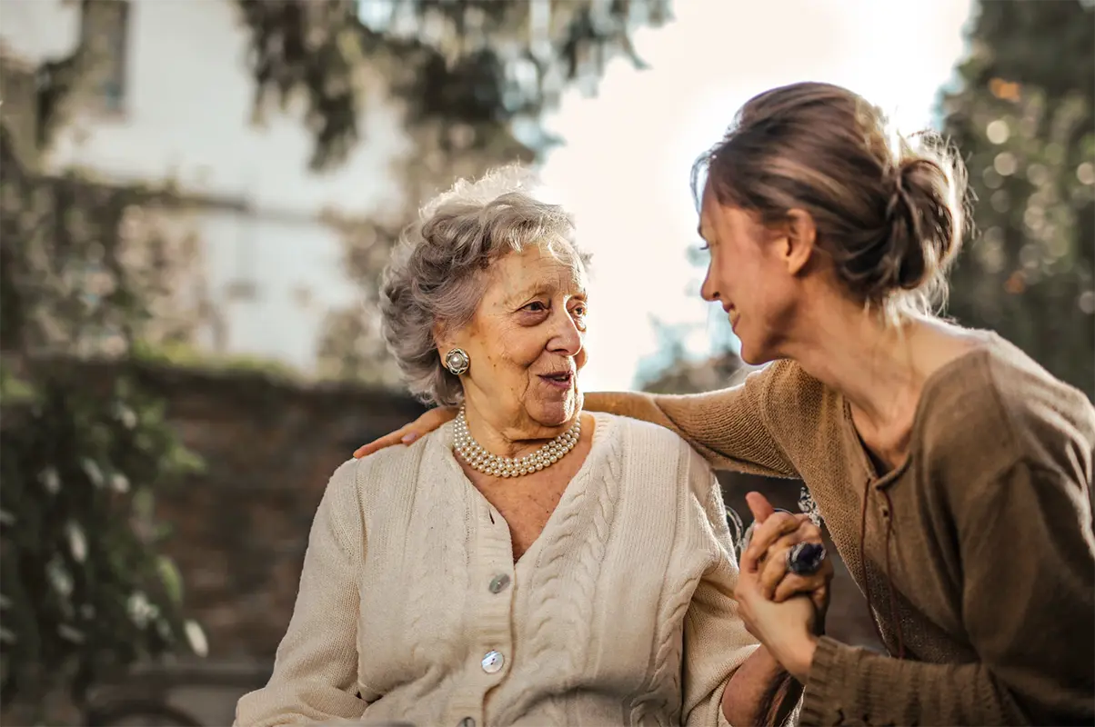 Elderly woman with adult daughter