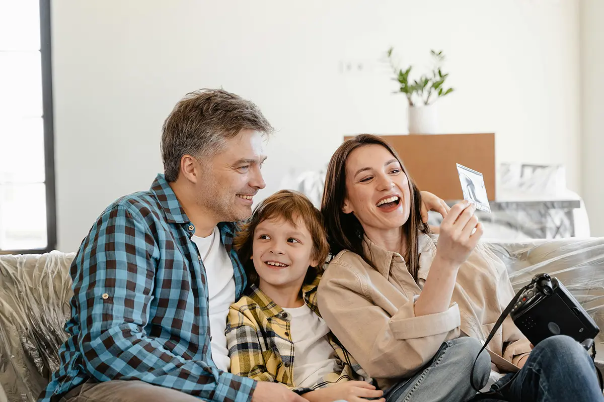 Parents and adult children laughing together