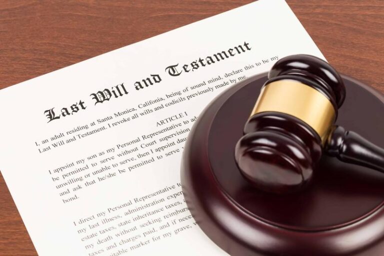 Last will and testament on yellowish paper with wooden judge gavel